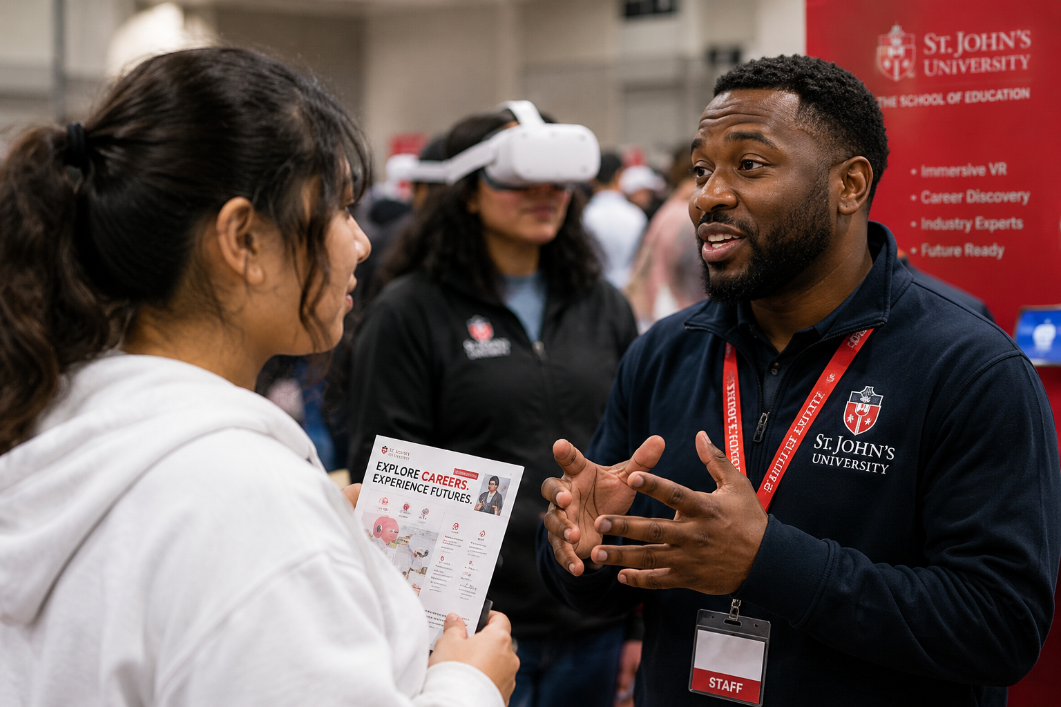 A St. John’s University advisor speaking with a prospective Academy participant